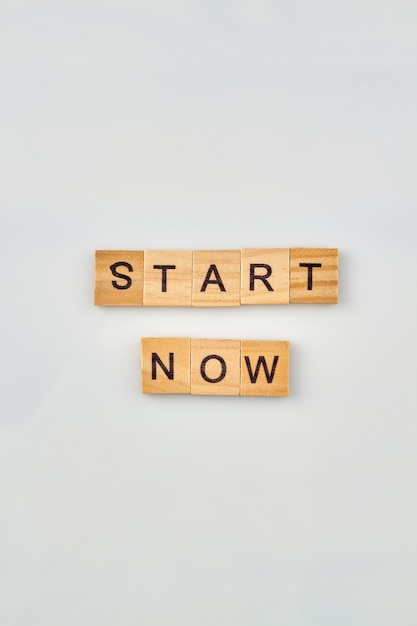 Photo start word concept. quote for inspiration and getting progress and success. alphabet wooden cubes for words.