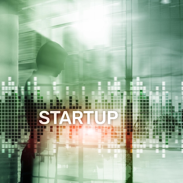 Startup concept with double exposure diagrams blurred background