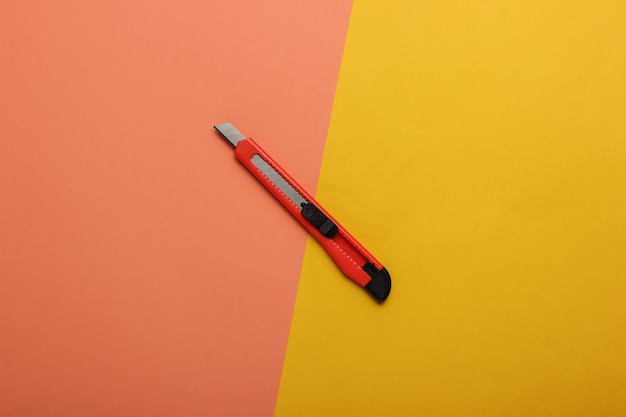 Stationery knife for cutting paper on colored paper