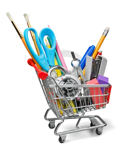 Stationery objects in mini supermarket cart on  background