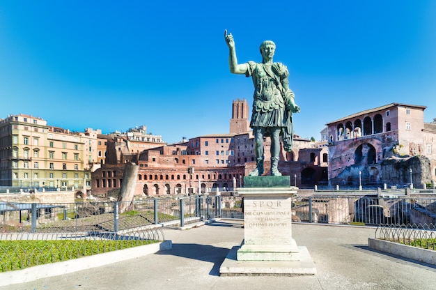 The statue of Emperor Traiano along Fori Imperiali street in Rome