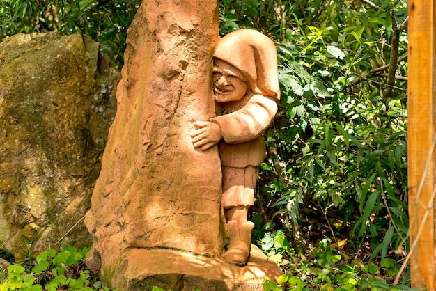 Statue of a gnome in the forest sculpture garden in Brazil