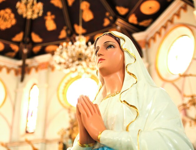 Statue of Mary praying in profile