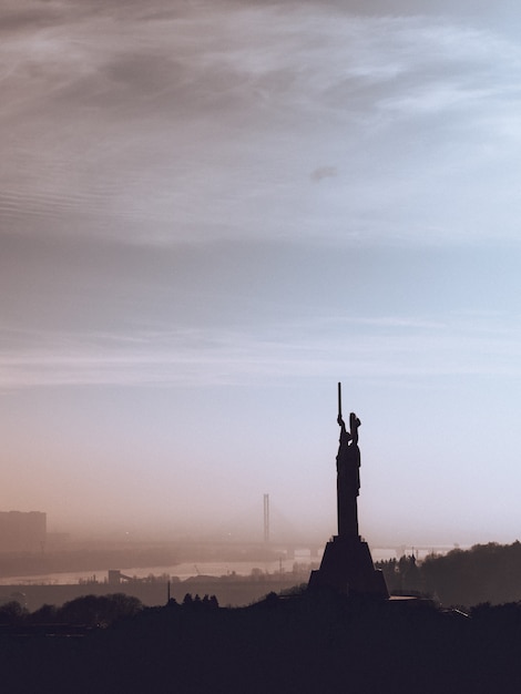 statue at sunset