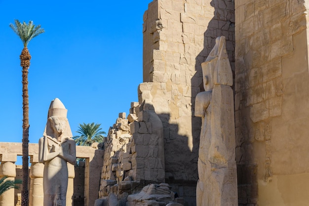 Statues in ancient Karnak temple Luxor Egypt