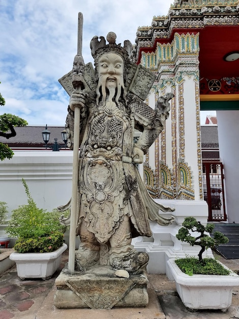 The statues Chinese giants guarding at the gate of the Reclining Buddha Wat Phra Chetuphon Bangkok