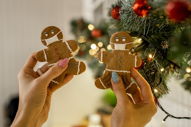 Stay home quarantine from Covid19 Christmas gingerbread men with a masks