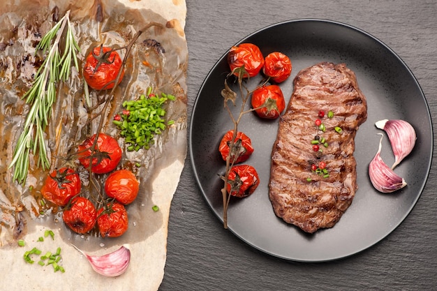 Steak Ribeye entrecote and baked tomatoes