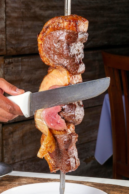 Steak rotisserie at the steakhouse sliced picanha Picanha