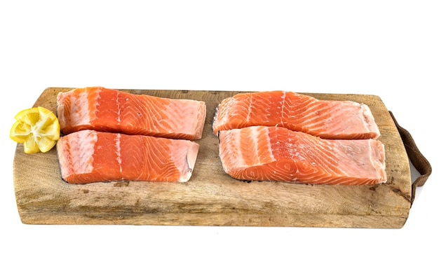 Steak of salmon in front of white background