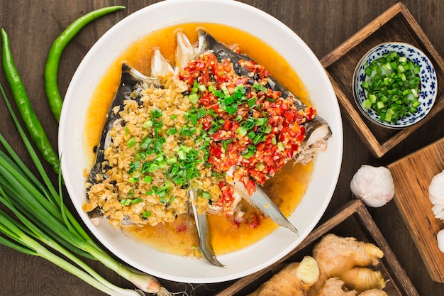 Steamed fish head with diced hot red peppers