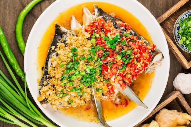 Steamed fish head with diced hot red peppers