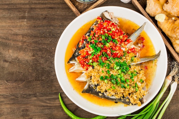 Steamed fish head with diced hot red peppers