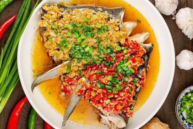 Photo steamed fish head with diced hot red peppers