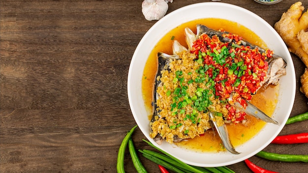 Steamed fish head with diced hot red peppers