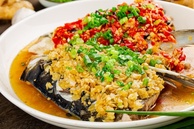 Steamed fish head with diced hot red peppers