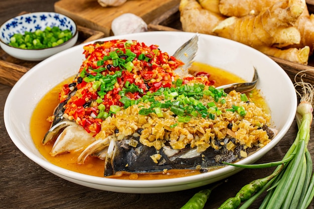 Steamed fish head with diced hot red peppers