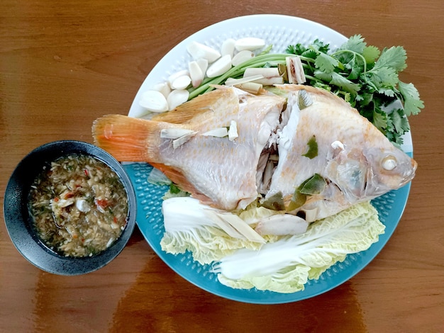 Steamed Fish with Chili Lime Saucethai Traditional Thai food thai style steamed fish on table cl