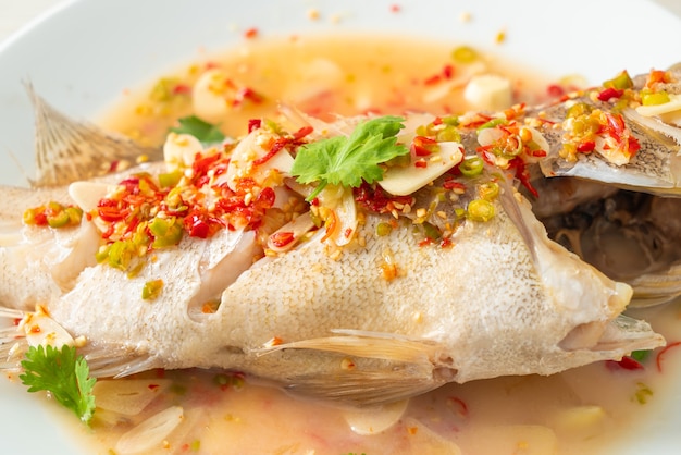 Steamed grouper fish with lime and chillies - Asian food style