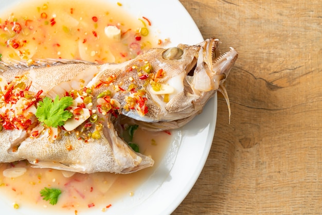 Steamed grouper fish with lime and chillies - Asian food style