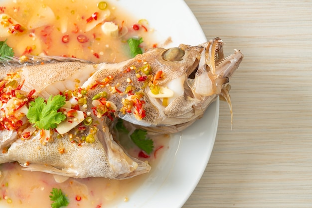 Steamed grouper fish with lime and chillies - Asian food style