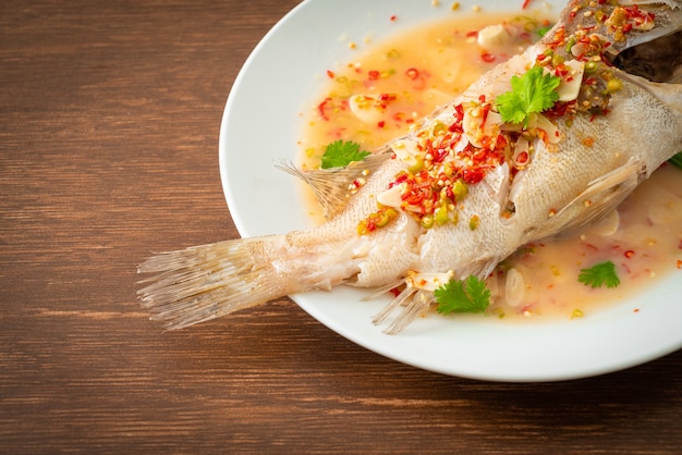 Steamed grouper fish with lime and chillies - Asian food style