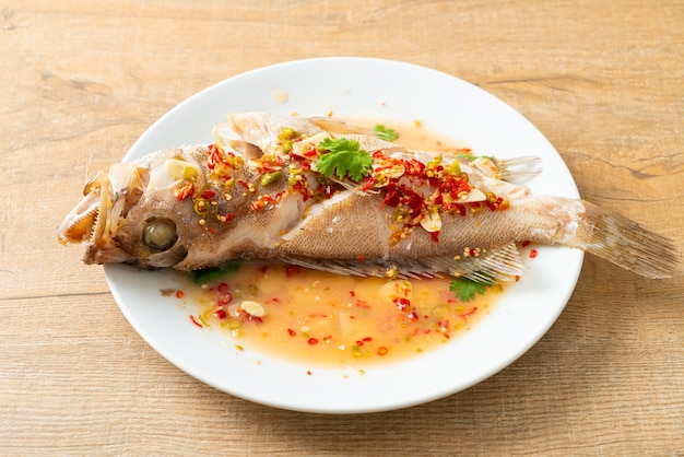 Steamed grouper fish with lime and chillies - Asian food style