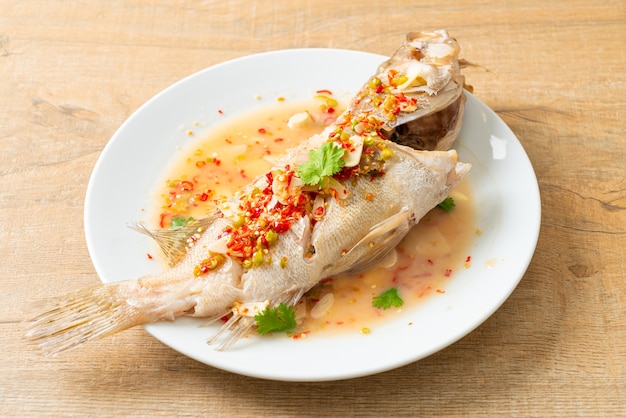 Steamed grouper fish with lime and chillies - Asian food style