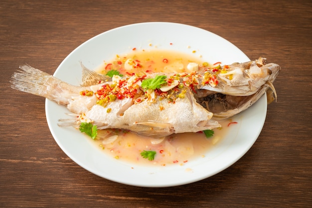 Steamed grouper fish with lime and chillies - Asian food style