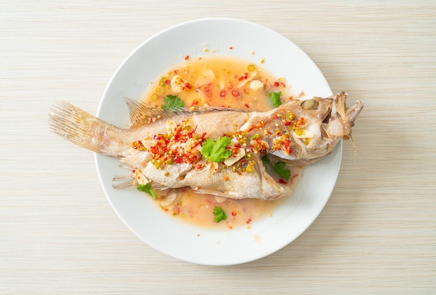 Steamed grouper fish with lime and chillies - Asian food style