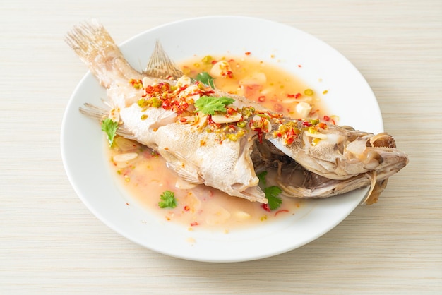 Steamed grouper fish with lime and chillies - Asian food style