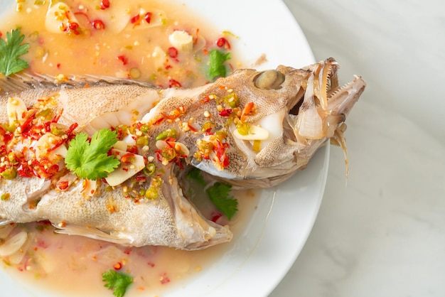 Steamed grouper fish with lime and chillies - Asian food style