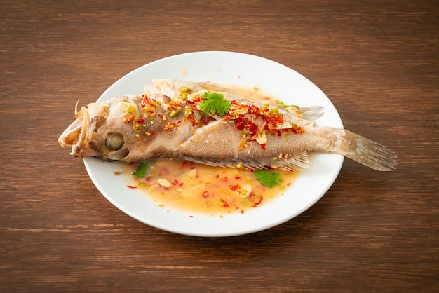 Steamed grouper fish with lime and chillies - Asian food style