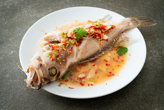 Steamed grouper fish with lime and chillies - Asian food style