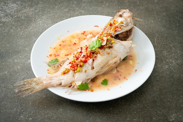 Steamed grouper fish with lime and chillies