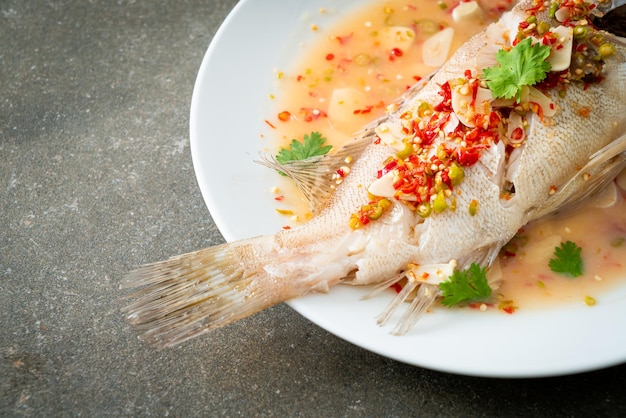 Steamed grouper fish with lime and chillies