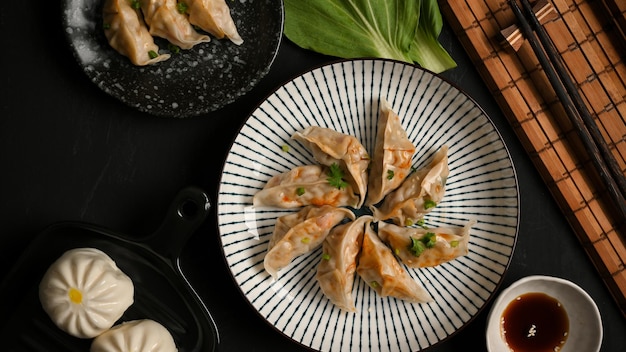 Steamed Japanese dumplings and pork buns on a plate asian food concept asian gyoza dumplings