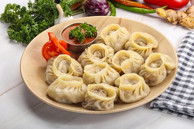 Steamed Nepali dumpling Momo with sauce stuffed chicken meat seafood or vegetables