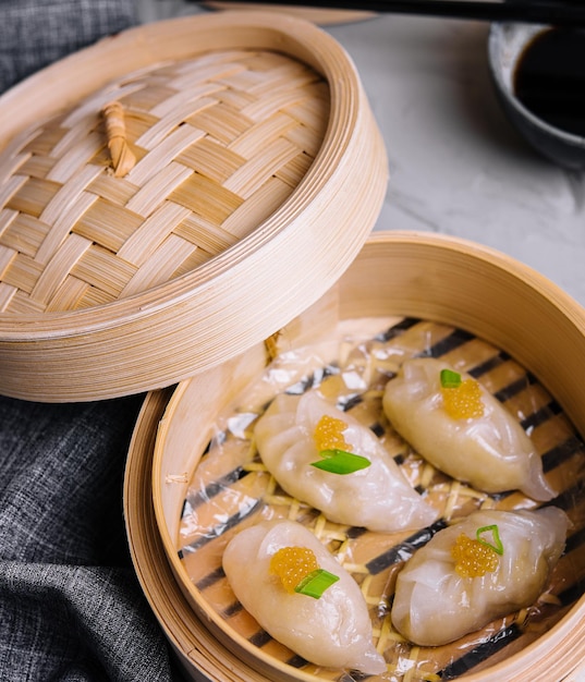 Steamed shrimp dumplings dim sum with pike caviar