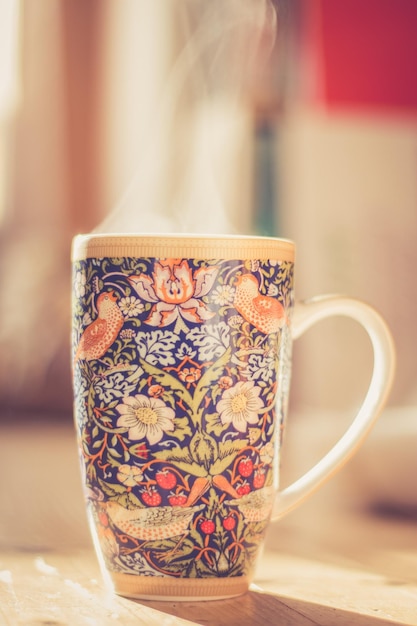 Steaming tea cup and sunlight warmup in winter