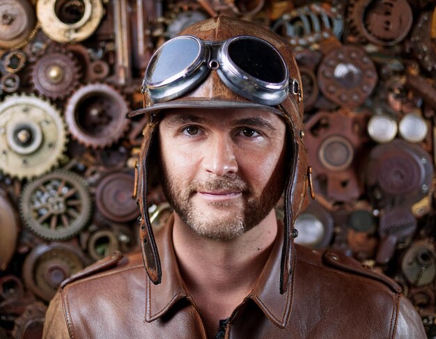 Photo steampunk gentleman portrait victorian man with goggles and mechanical accessories headshot