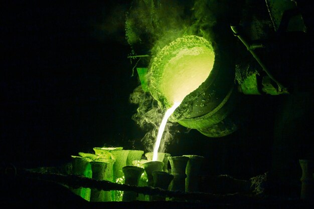 Steel casting process toned green for magic potion or chemical or biohazard or radioactive waste illustration