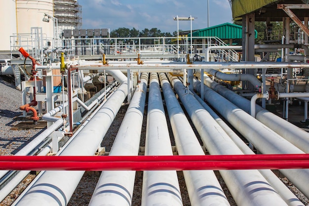 Steel long pipes and pipe elbow in station tank oil factory during refinery Petrochemistry industry in gas site distillery