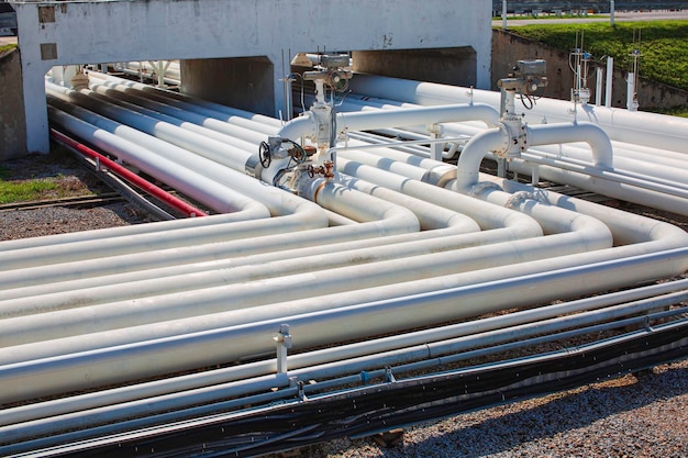 Steel long pipes and pipe elbow in station tank oil factory during refinery Petrochemistry industry in gas site distillery