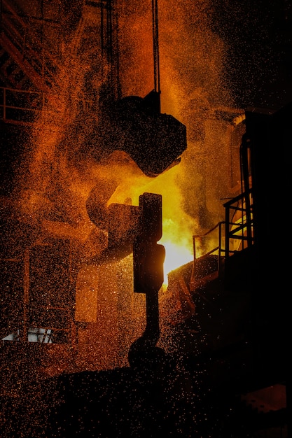 Photo steel production in electric furnaces. sparks of molten steel. electric arc furnace shop eaf. metallurgical production, heavy industry, engineering, steelmaking.