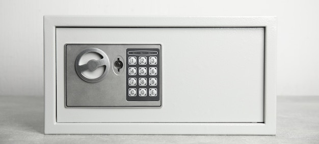 Steel safe with electronic lock on white background banner design