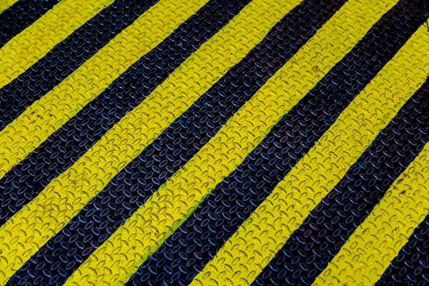 Steel sheet with yellow and black strip