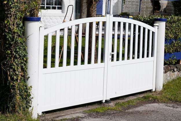 Steel white gate aluminum portal with blades of suburban house