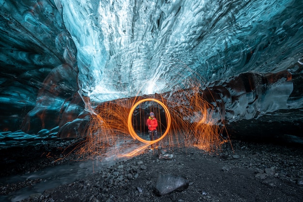 Steel wool fireshow inside a glacier ice cave in Iceland