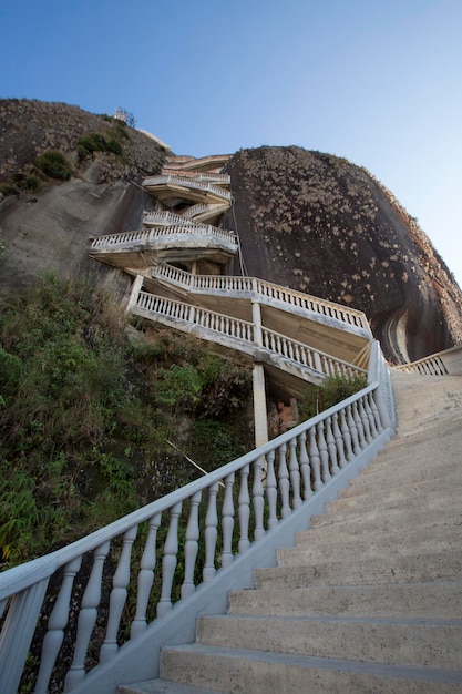 Steep steps rising up Guatape Rock the Piedra el Penol Colombia